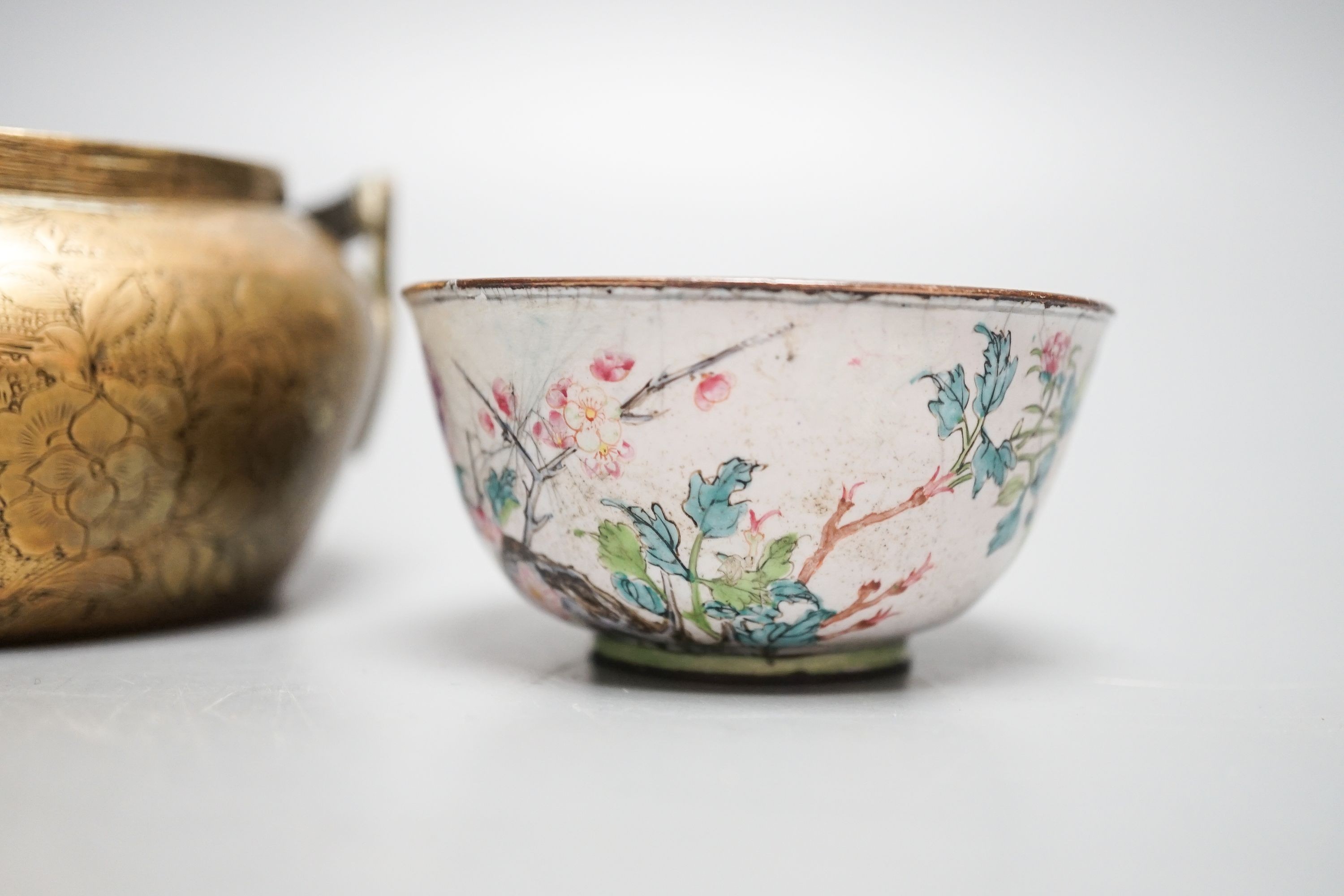 A Chinese bronze hand warmer, 11.3cm and an 18th century Chinese Canton enamel cup